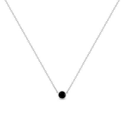 Front view of a white metal necklace with a single round black gemstone in a bezel setting pendant.