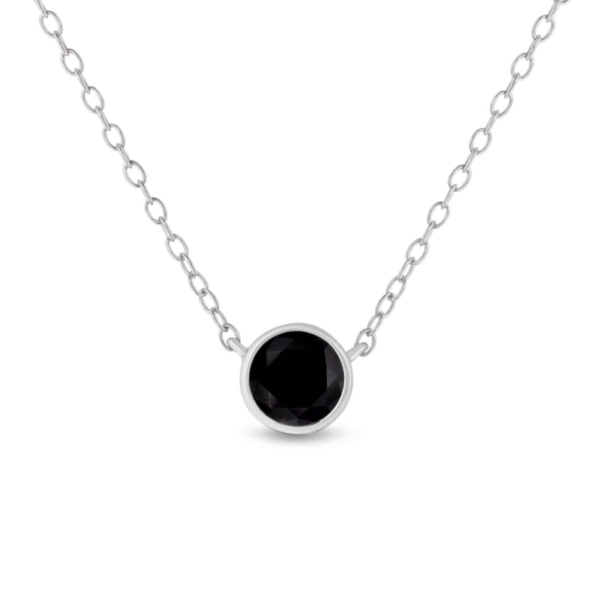 Front view of a white metal necklace with a round black gemstone in a bezel setting as the pendant.