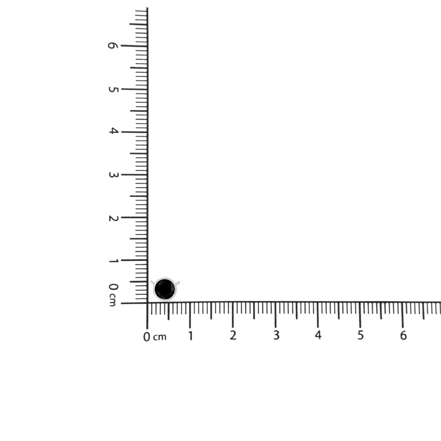 Top-down view of white necklace with single round black gemstone in bezel setting, placed on ruler for size reference.