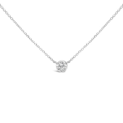 Front view of a white metal necklace with a round white gemstone in bezel setting at the center.