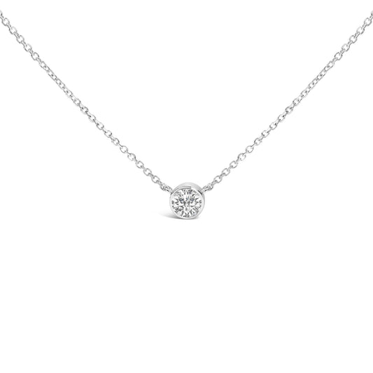 Front view of a white metal necklace with a round white gemstone in bezel setting at the center.