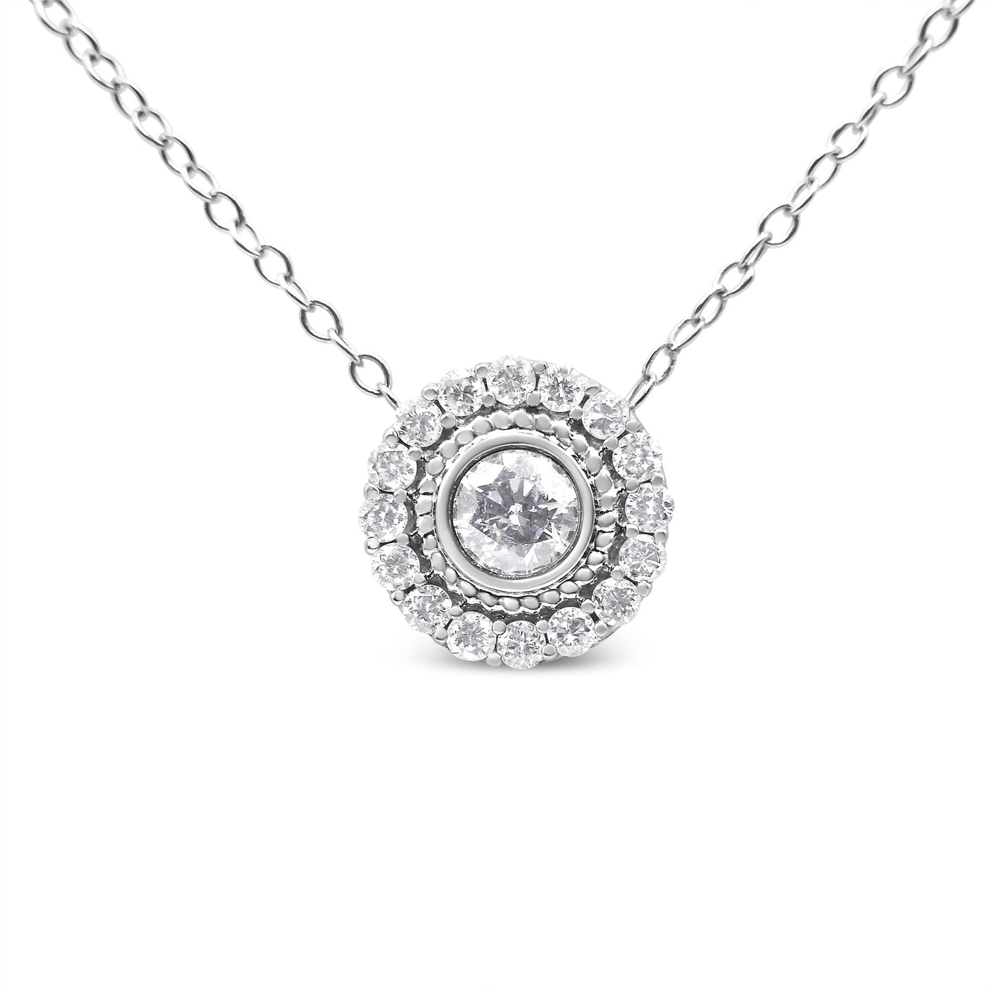 Front view of a white metal necklace with a round pendant featuring a centrally bezel-set round white gemstone surrounded by a halo of pave-set round white gemstones.