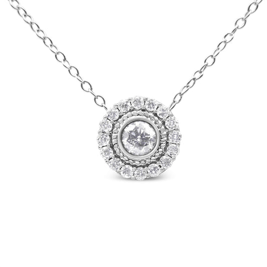 Front view of a white metal necklace with a round pendant featuring a centrally bezel-set round white gemstone surrounded by a halo of pave-set round white gemstones.