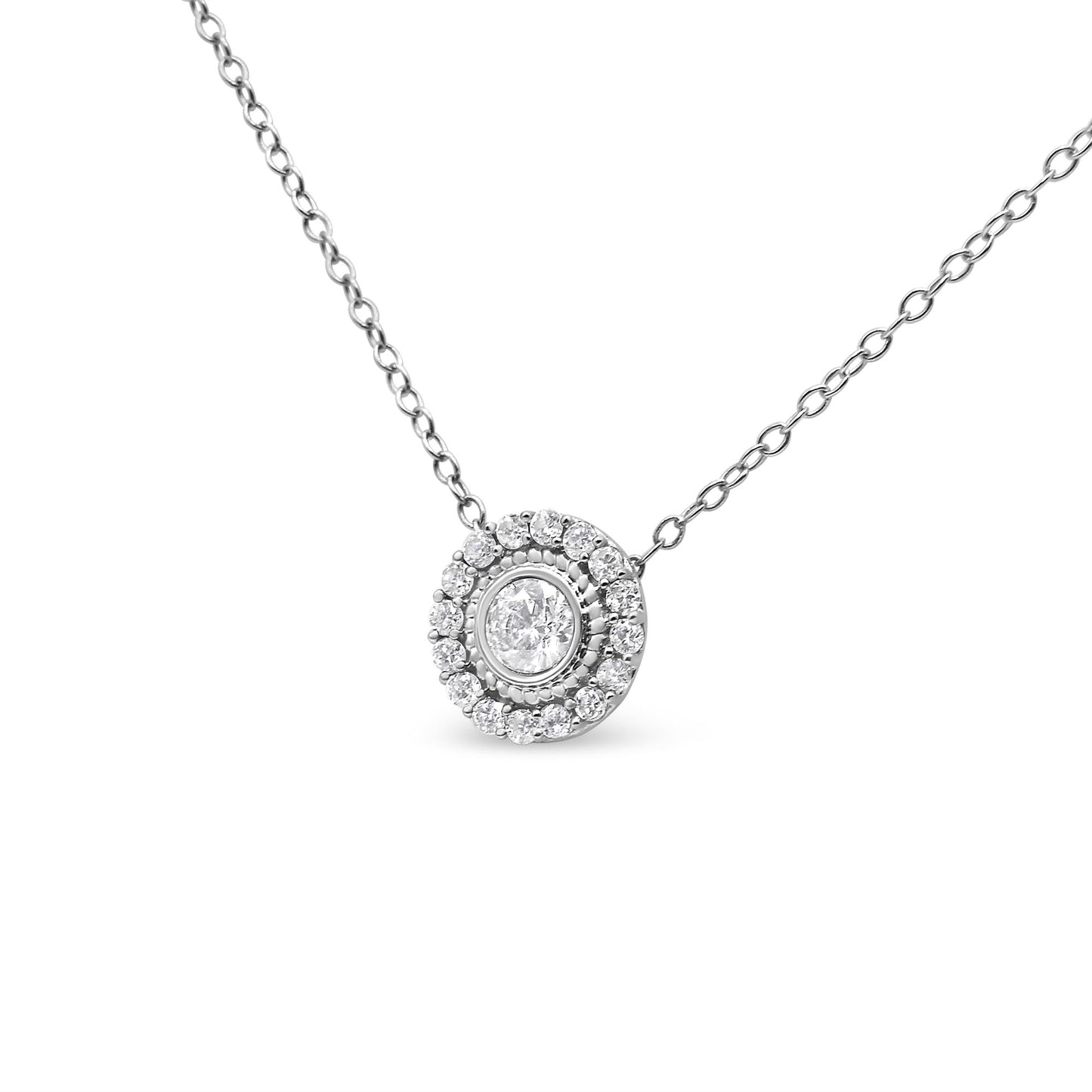 Close-up front view of a white metal necklace with a round central white gemstone in bezel setting, surrounded by a circle of smaller round white gemstones in pave settings.