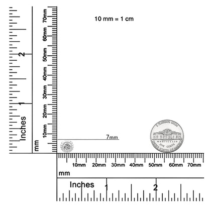 White metal round-shaped necklace with a white gemstone in bezel setting, shown on a ruler and scale for size reference, front angle.