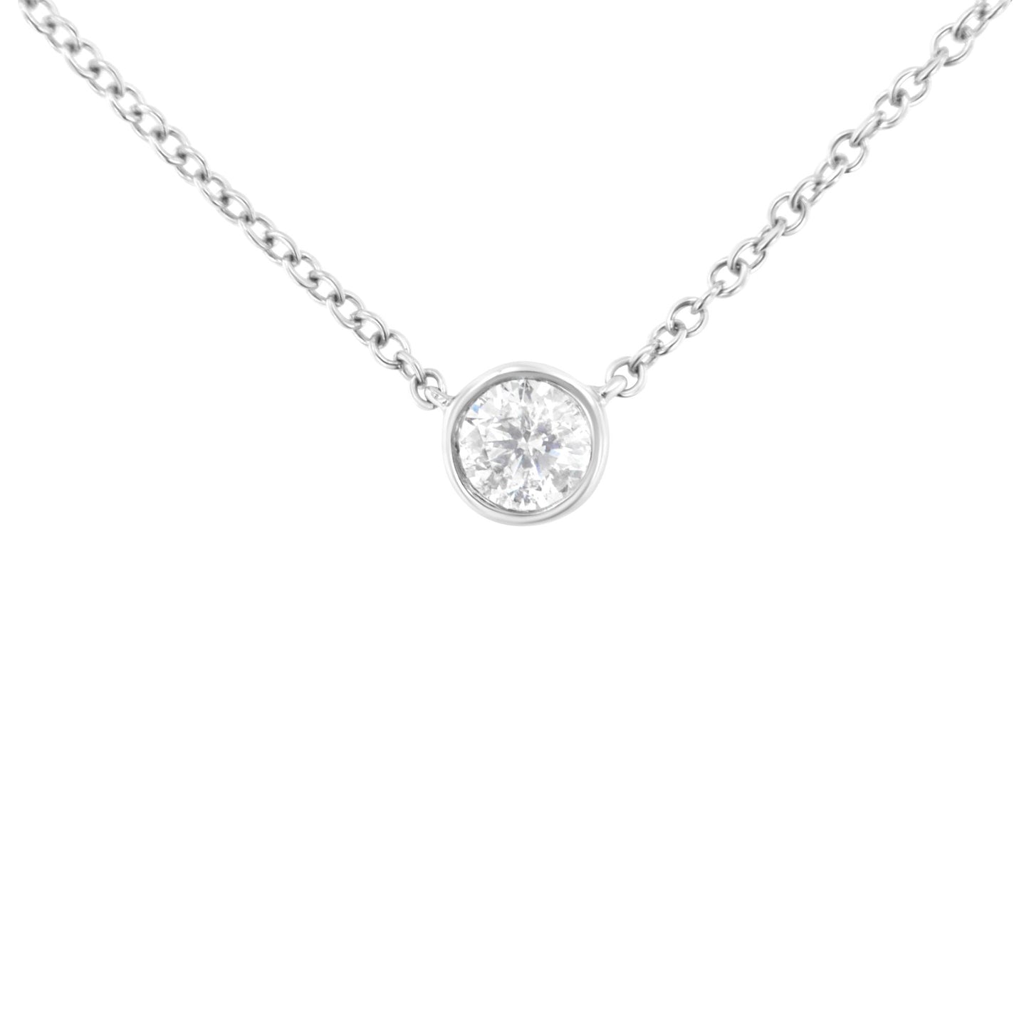 White metal necklace shown from front angle with single round white gemstone in bezel setting pendant.