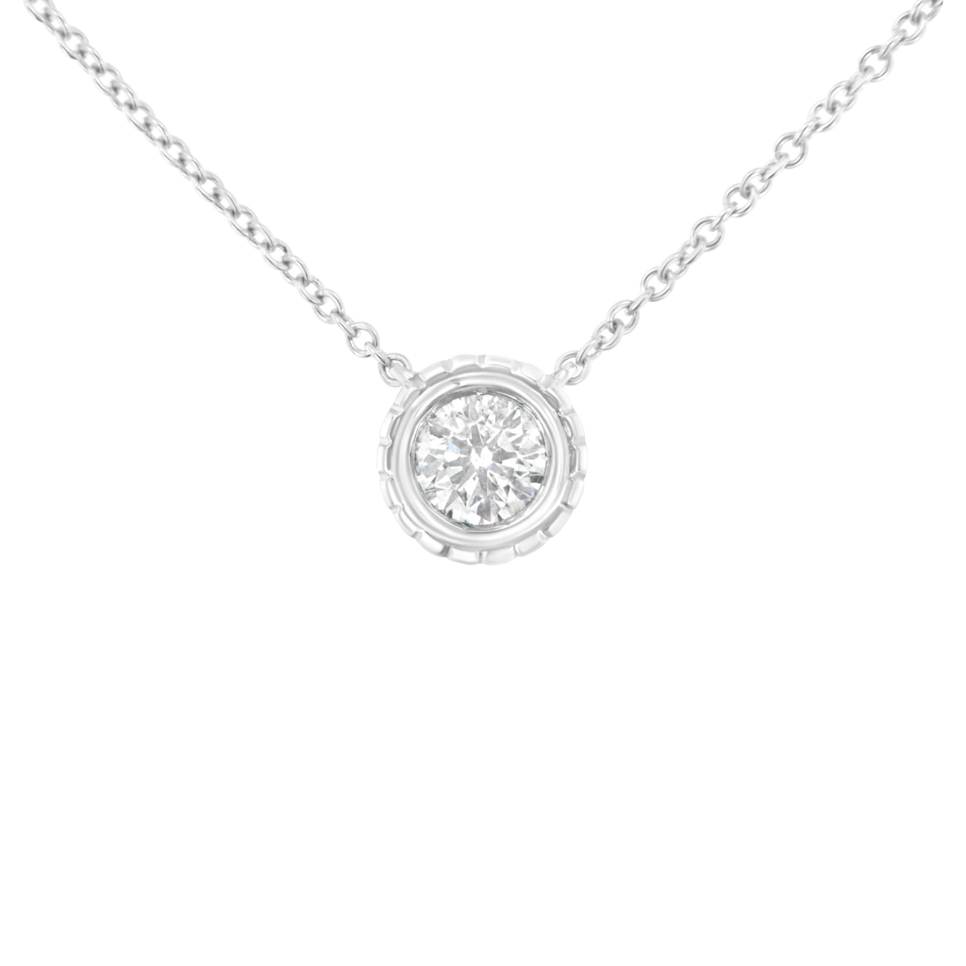 Front view of a white necklace with a round white gemstone in a bezel setting pendant.