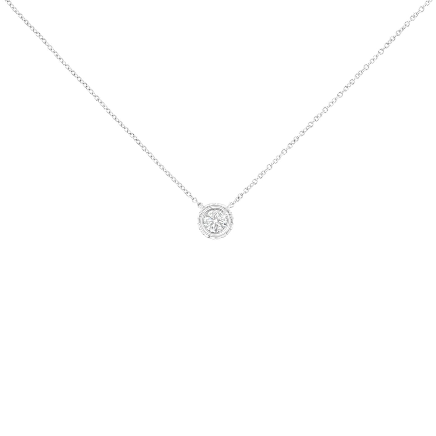 Front view of a white metal necklace with a single round white gemstone in bezel setting pendant.