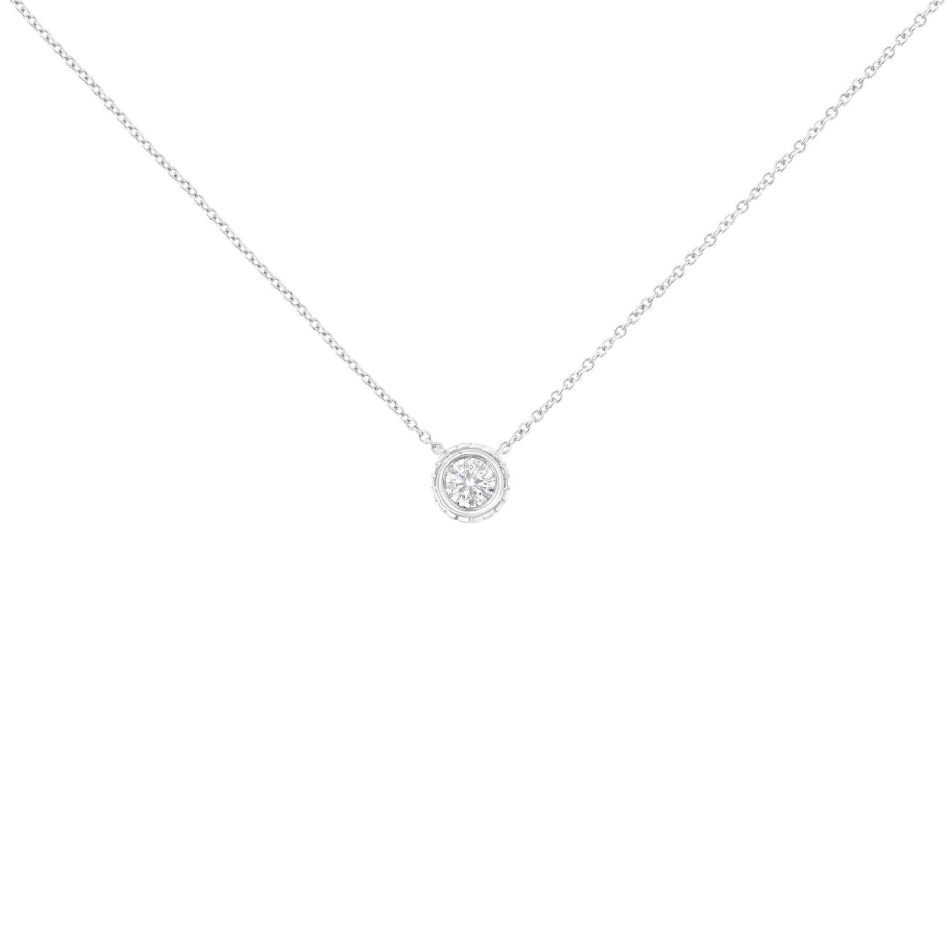 Front view of a white metal necklace with a single round white gemstone in bezel setting pendant.