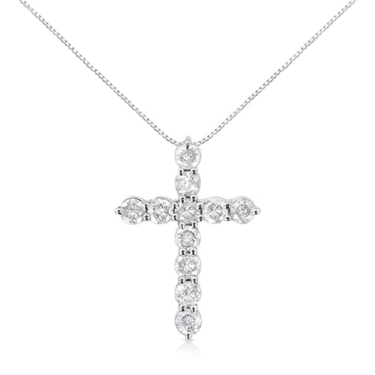 White metal necklace with a cross pendant featuring round white gemstones in prong settings, front view.