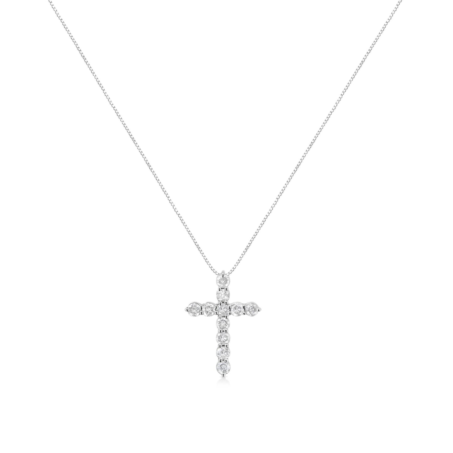 Front view of white metal necklace with cross-shaped pendant featuring round white gemstones in prong settings.