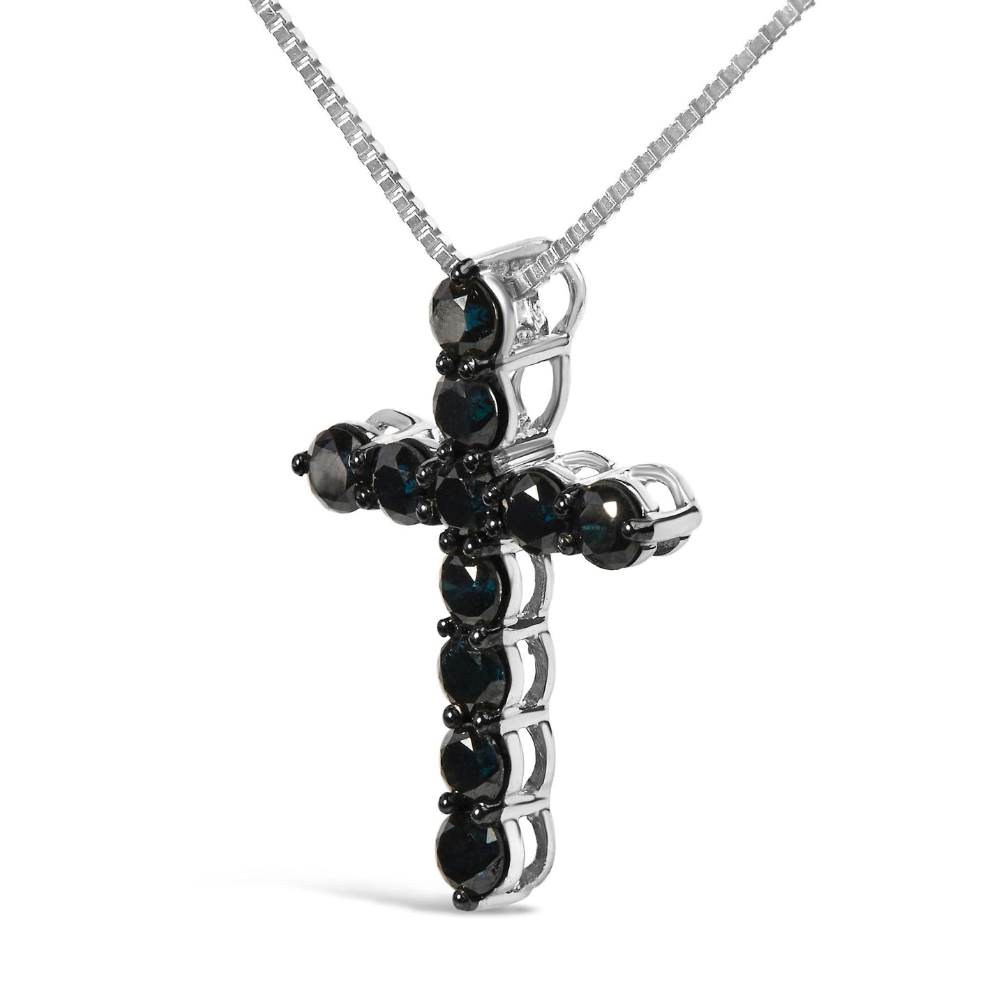 Close-up front angle of a white metal cross-shaped necklace pendant set with round black gemstones in prong settings, suspended from a white metal chain.