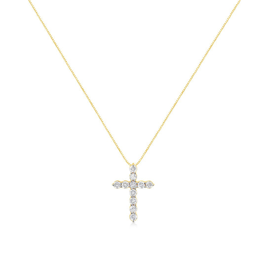 Front angle of a yellow metal necklace with a cross-shaped pendant featuring round white gemstones in prong settings.