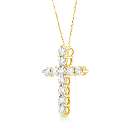 Front angled view of a yellow metal cross necklace adorned with round white gemstones in prong settings.