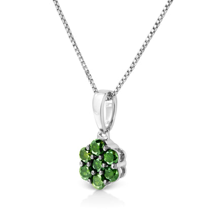 Close-up angled view of a white metal necklace pendant featuring a cluster of green round gemstones in prong settings.