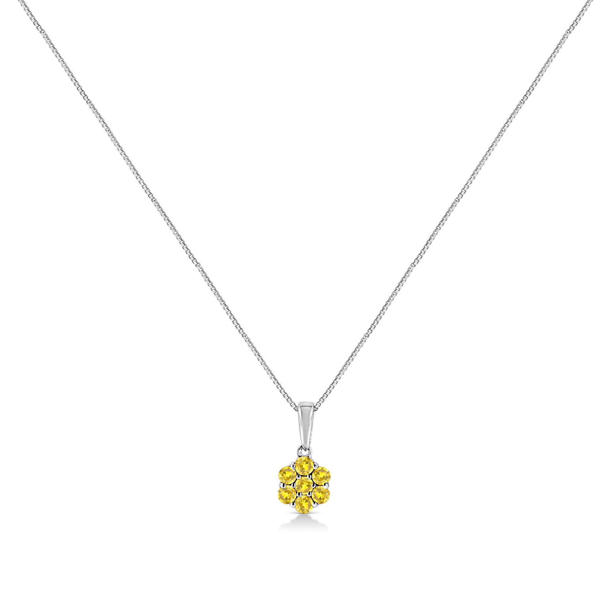 Front view of a white metal necklace with a pendant featuring round yellow gemstones in a cluster design.