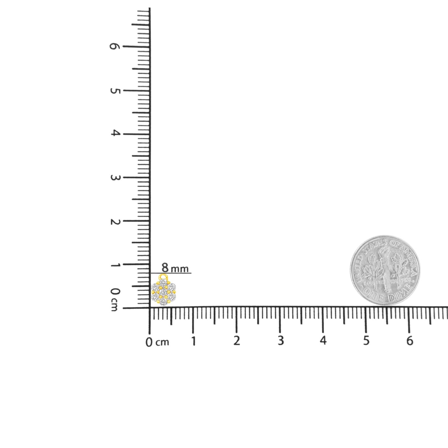 Yellow metal necklace pendant with cluster of round white gemstones in prong setting, shown on ruler and next to coin for size reference, front angle.