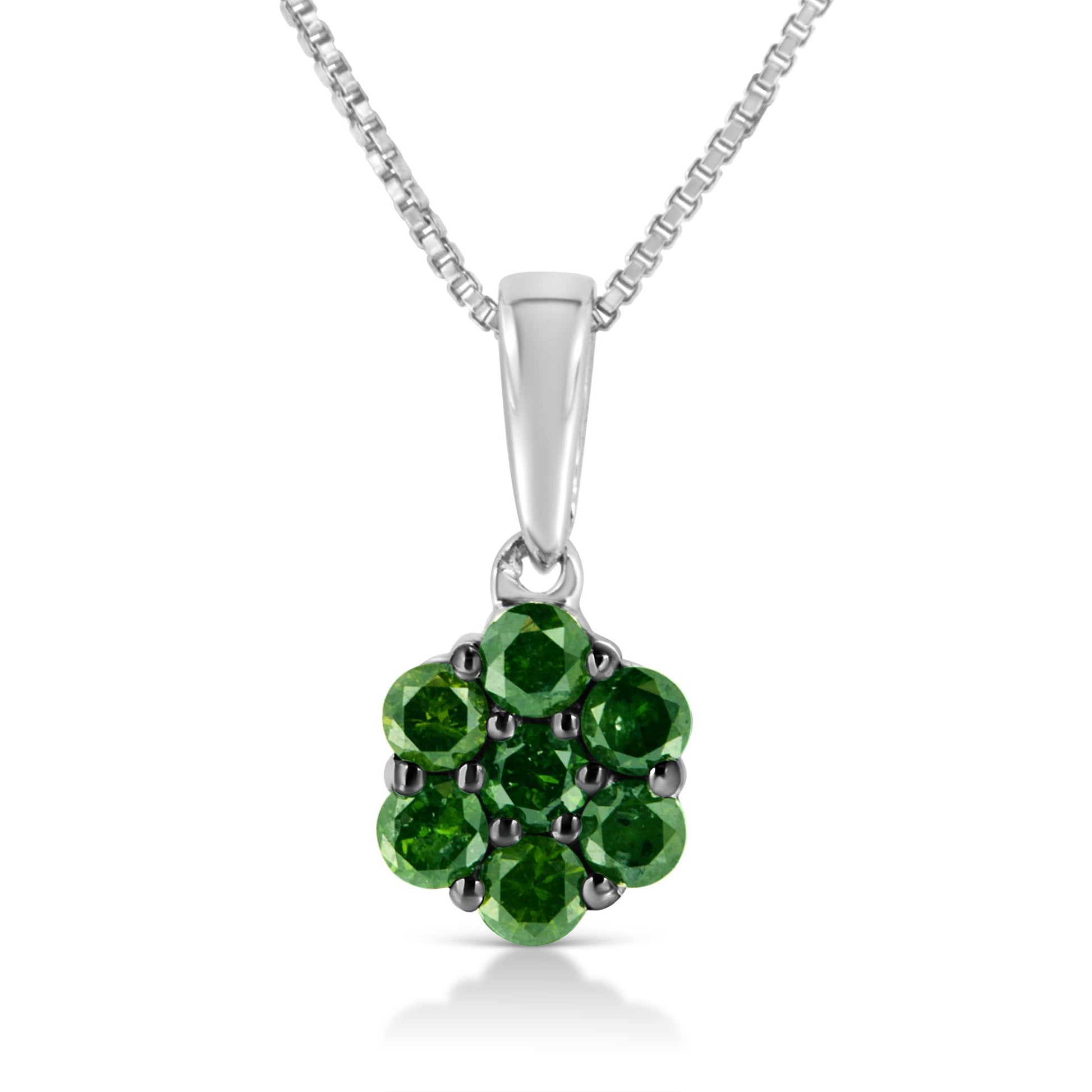 Front view of white metal necklace pendant with prong-set round green gemstones arranged in a flower shape.