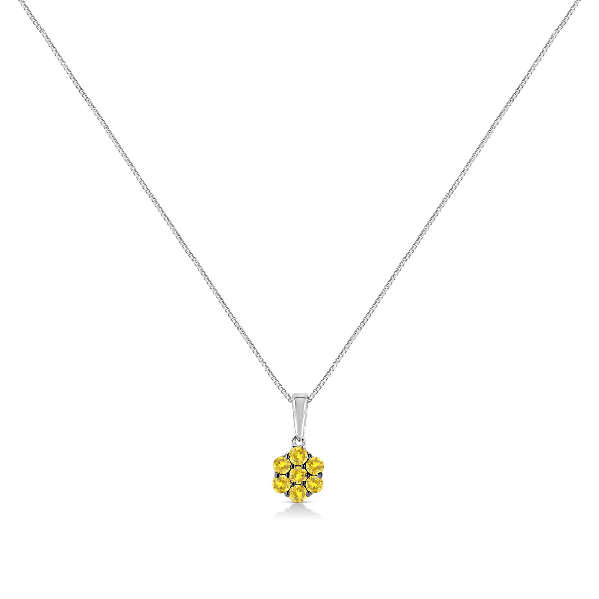 Front angle view of a white metal necklace with a pendant featuring seven round yellow gemstones in prong settings.