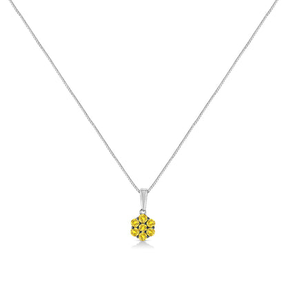 Front angle view of a white metal necklace with a pendant featuring seven round yellow gemstones in prong settings.