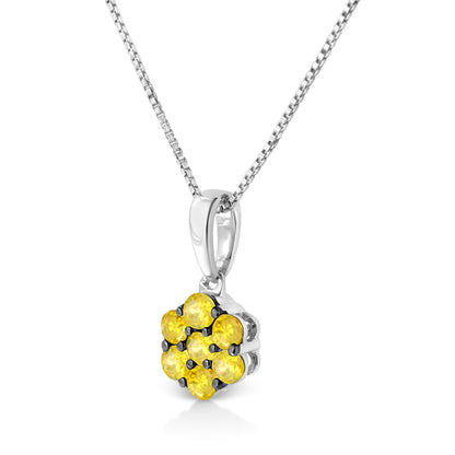 Close-up front angle of a white metal necklace with a pendant featuring seven round yellow gemstones in a prong setting.