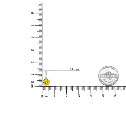 White metal necklace pendant with cluster of round yellow gemstones in prong setting, shown on a ruler for size reference, front angle.