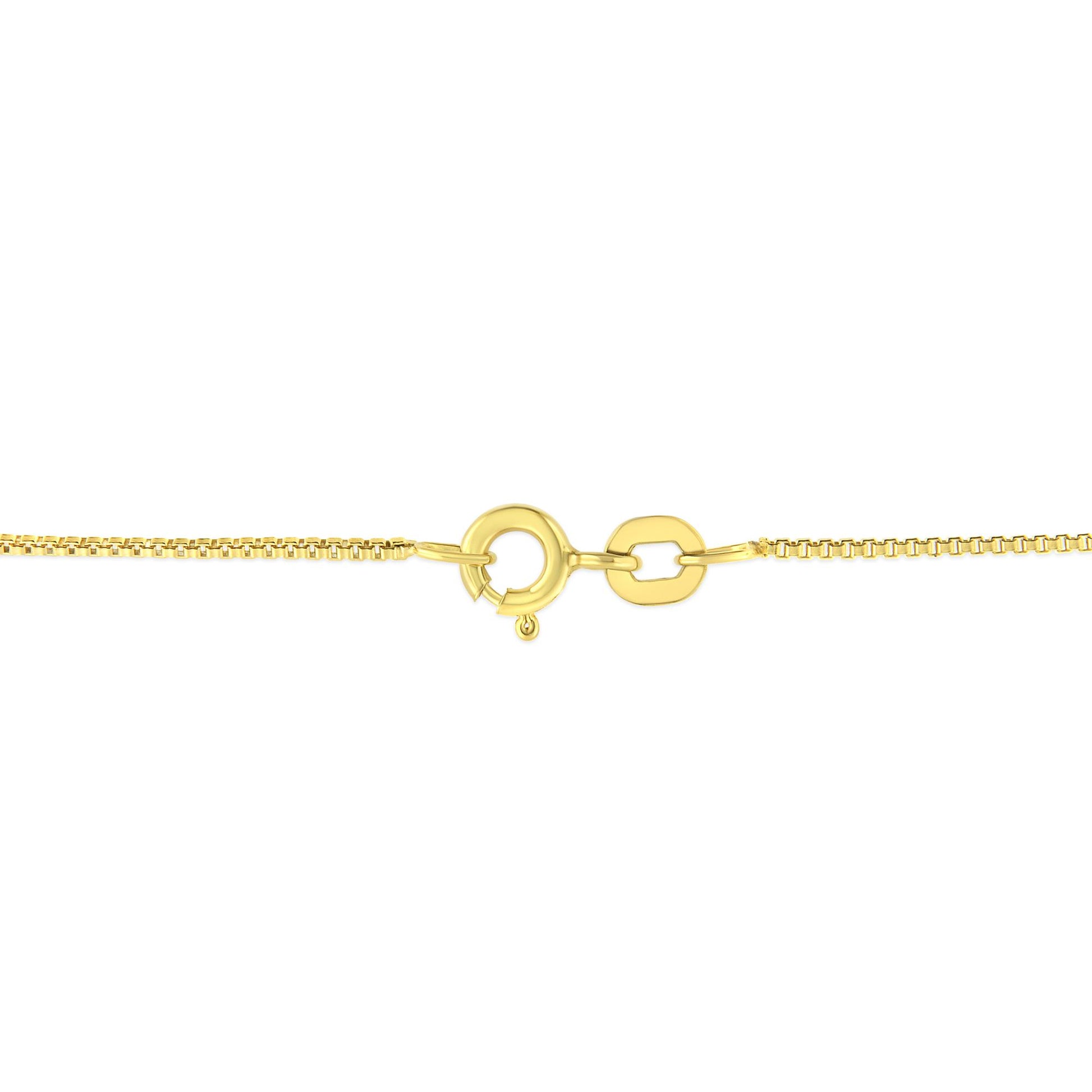 Close-up image of a yellow necklace clasp viewed from the front.
