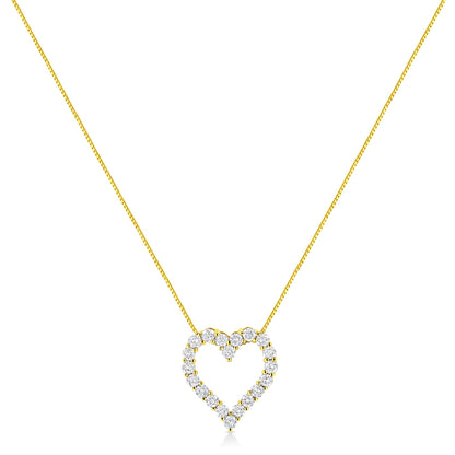 Front view of a yellow metal necklace with a heart-shaped pendant featuring round prong-set brownish gemstones.
