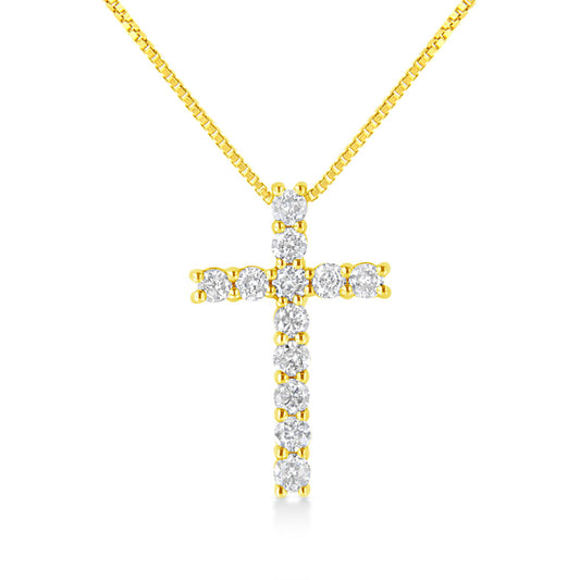 Front angle view of a yellow metal necklace with a cross-shaped pendant featuring round white gemstones in prong settings.