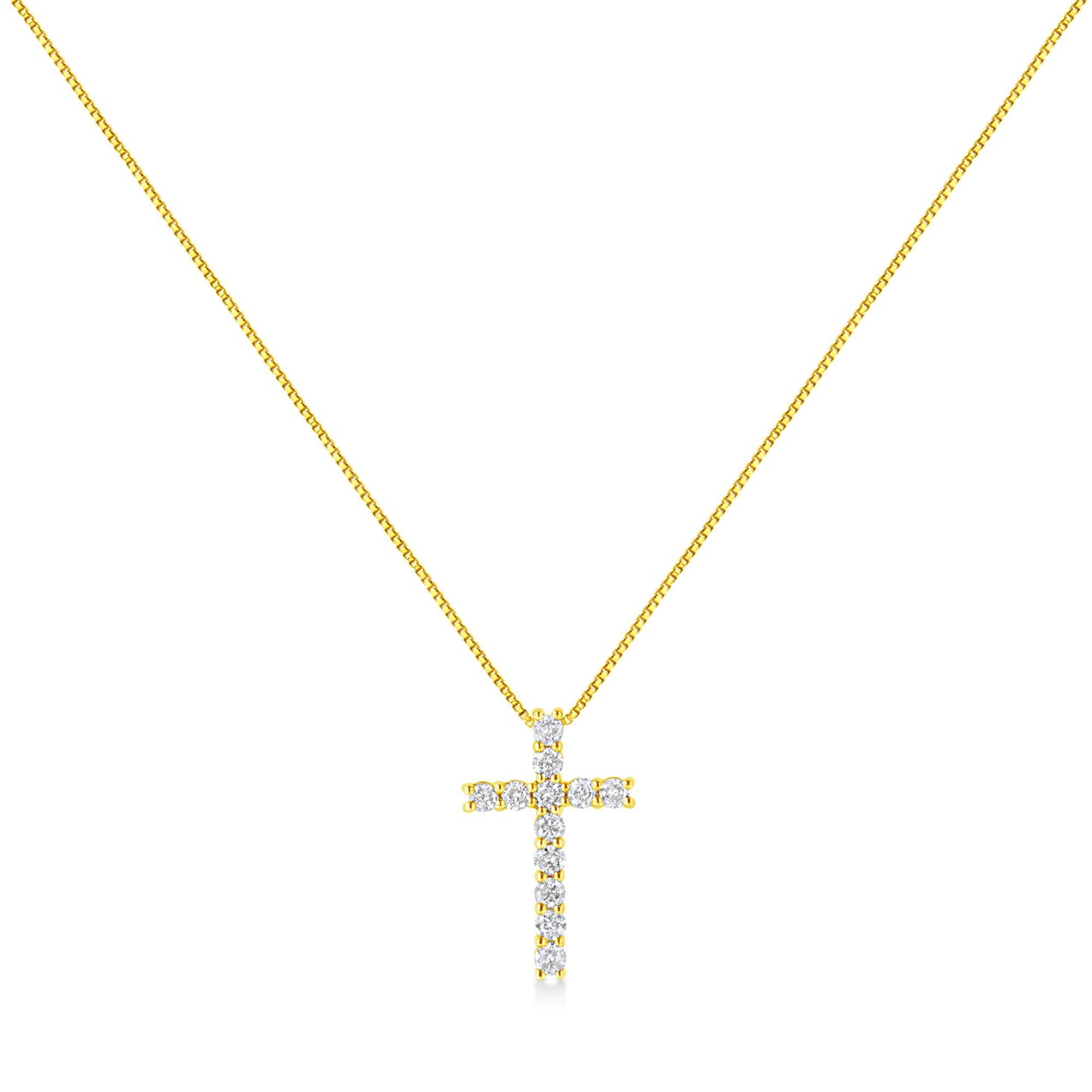 Front-facing shot of a yellow metal necklace with a cross pendant adorned with round white gemstones in prong settings.
