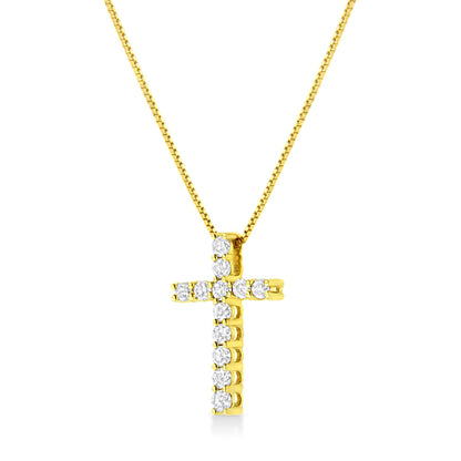 Front angle view of a yellow metal cross necklace with round white gemstones in prong settings.