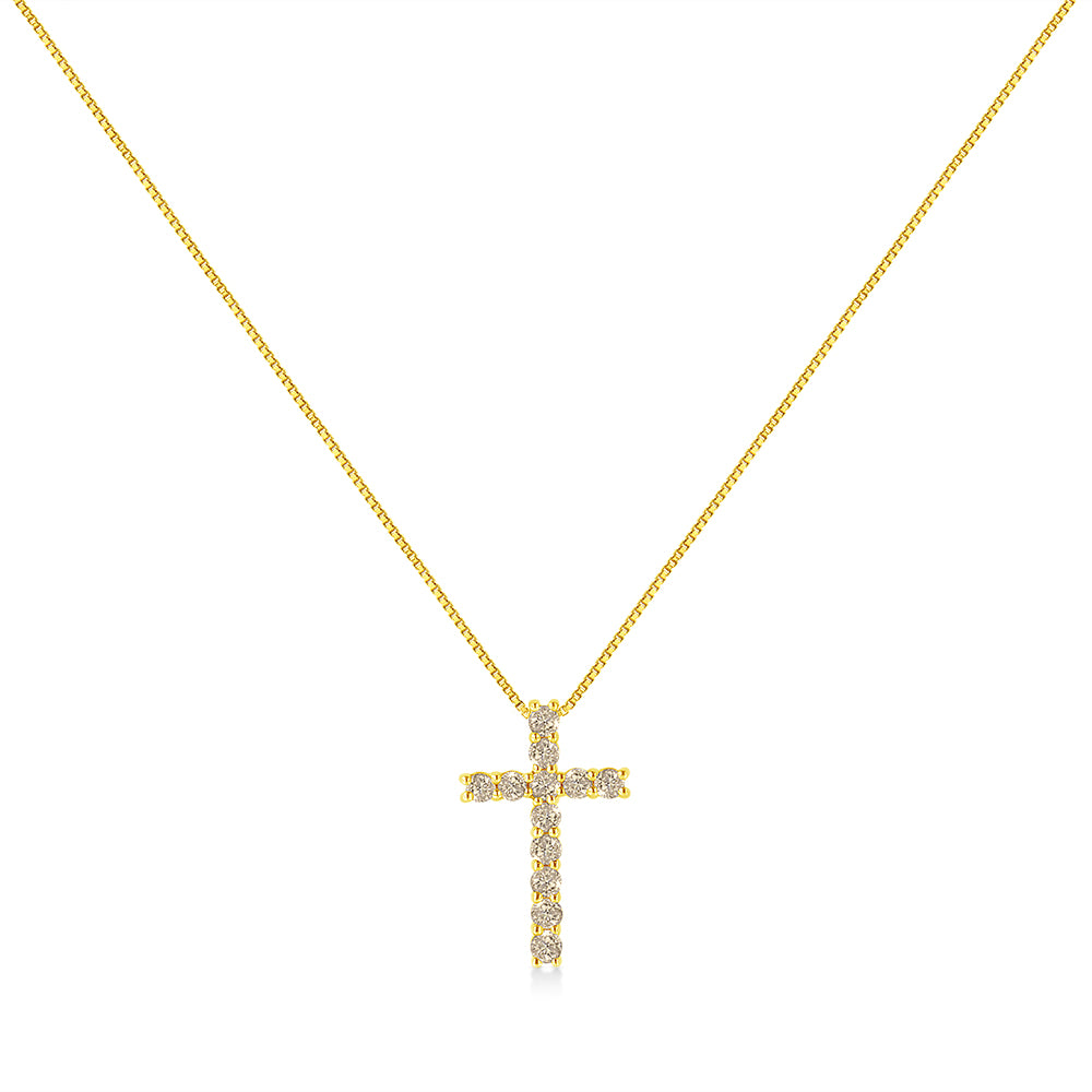 Front-facing image of a yellow metal necklace with a cross pendant adorned with round-shaped brownish prong-set gemstones.