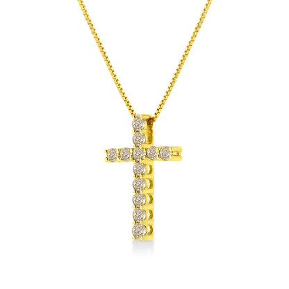Front view of a yellow metal cross pendant necklace with round brownish gemstones in prong settings.