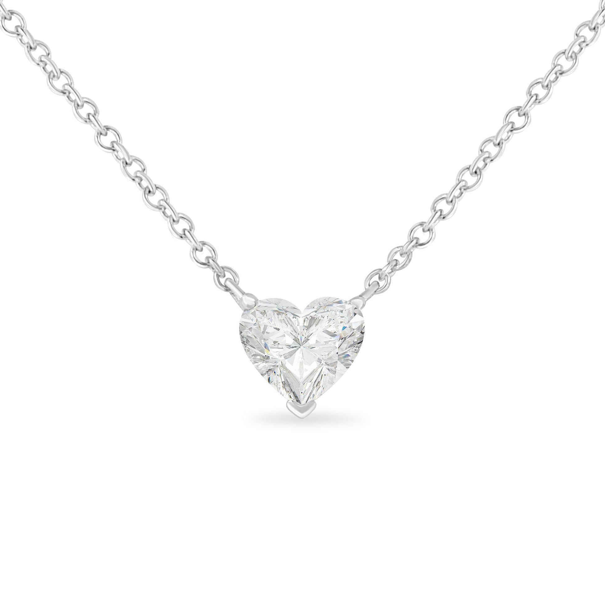 Front view of a white metal necklace with a heart-shaped white gemstone in prong setting.