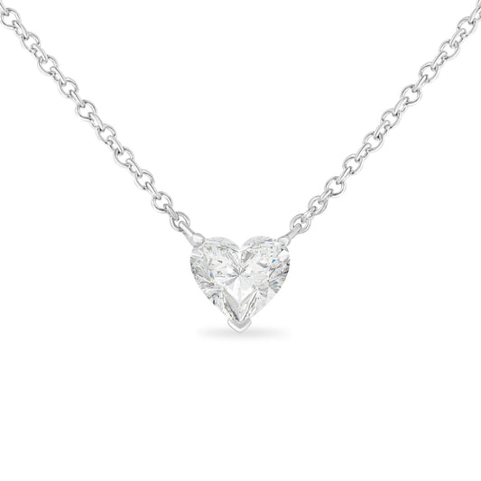 Front view of a white metal necklace with a heart-shaped white gemstone in prong setting.