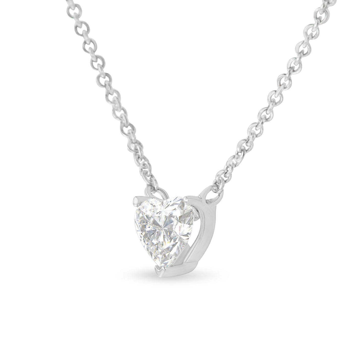 Front angle view of a white metal necklace with a heart-shaped white gemstone in a prong setting.