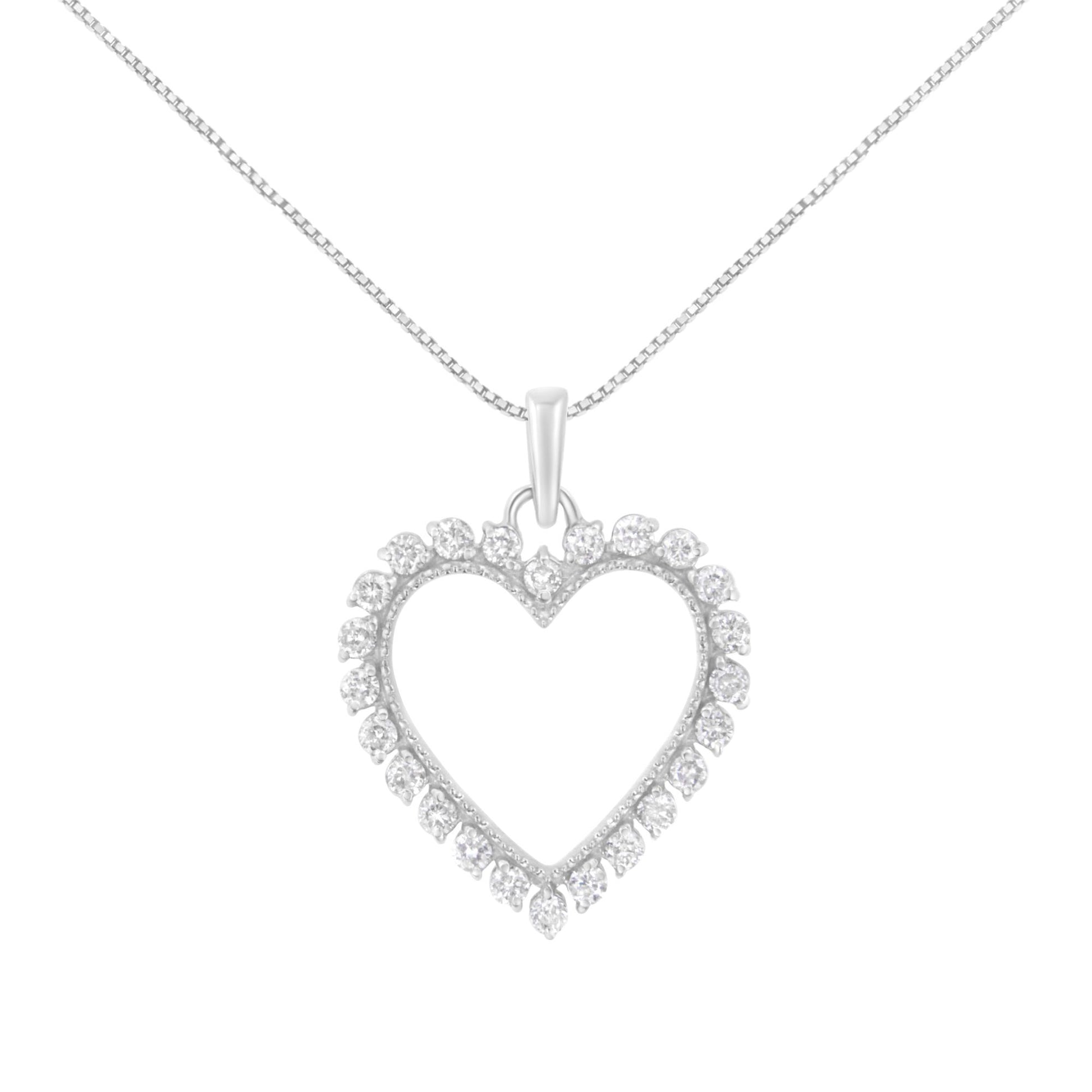 Front angle of white necklace with heart-shaped pendant featuring round white gemstones set in prongs around the heart outline.