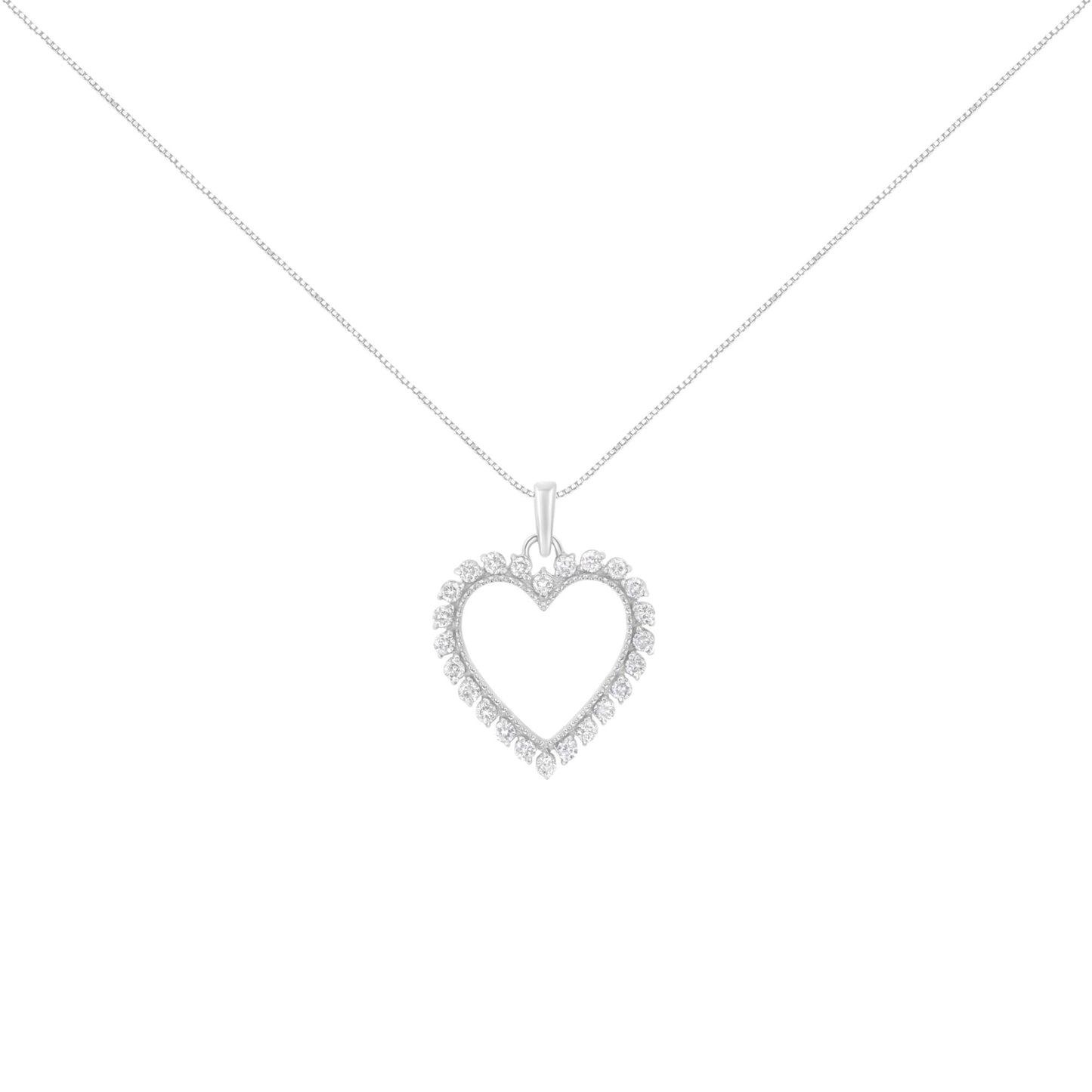 Front angle view of a white metal heart-shaped necklace pendant with round white gemstones in a prong setting, hanging on a chain.