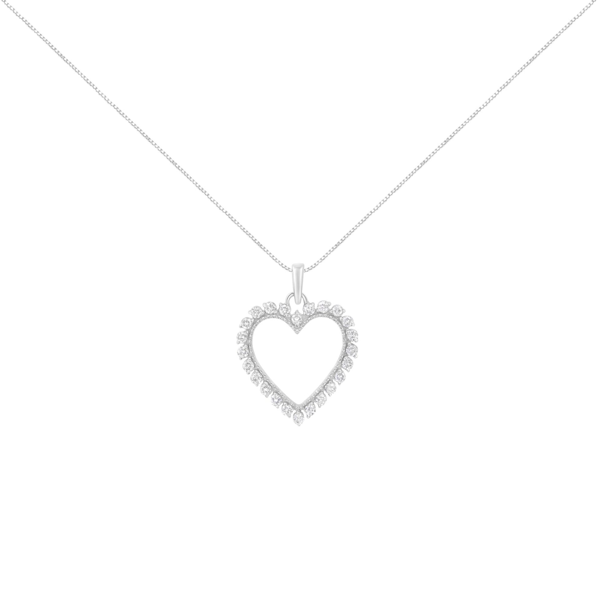 Front angle view of a white metal heart-shaped necklace pendant with round white gemstones in a prong setting, hanging on a chain.