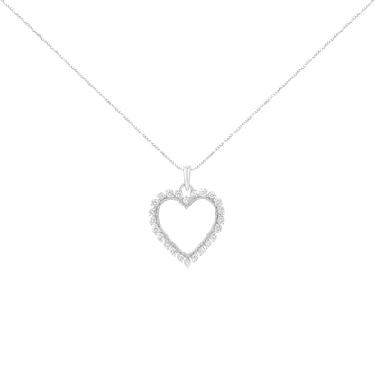 Front angle view of a white metal heart-shaped necklace pendant with round white gemstones in a prong setting, hanging on a chain.