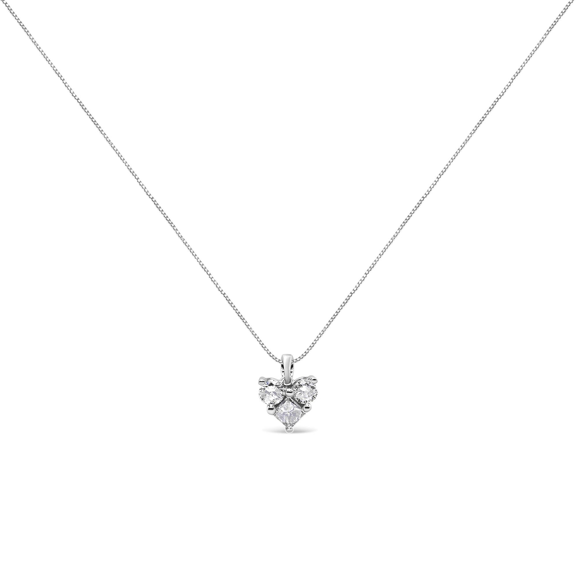 Front view of a white metal necklace with a pendant featuring one princess shape white gemstone and two round shape white gemstones in prong settings.