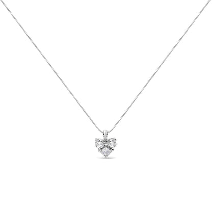 Front view of a white metal necklace with a pendant featuring one princess shape white gemstone and two round shape white gemstones in prong settings.