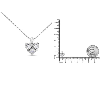 White metal necklace with a heart-shaped pendant featuring one princess shape white gemstone and two round shape white gemstones, displayed with a ruler and a coin for size reference, front view.