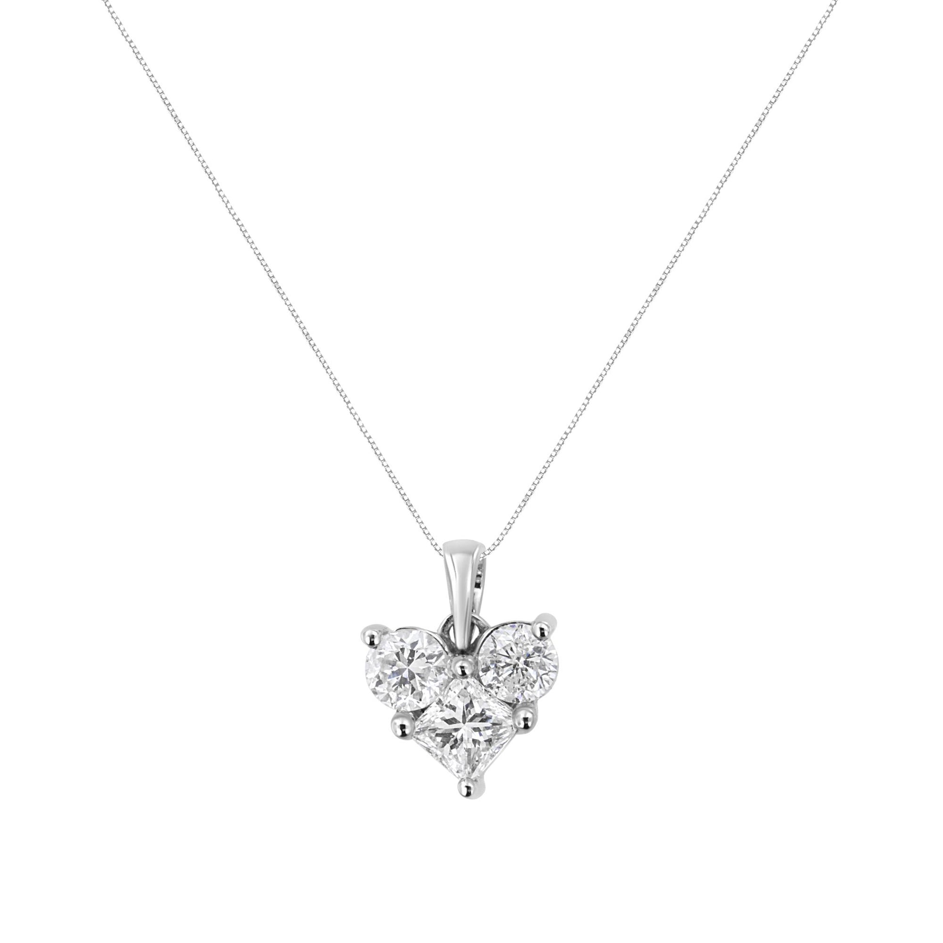 Front view of a white metal necklace with a heart-shaped pendant featuring one princess-shaped white gemstone and two round-shaped white gemstones in prong settings.