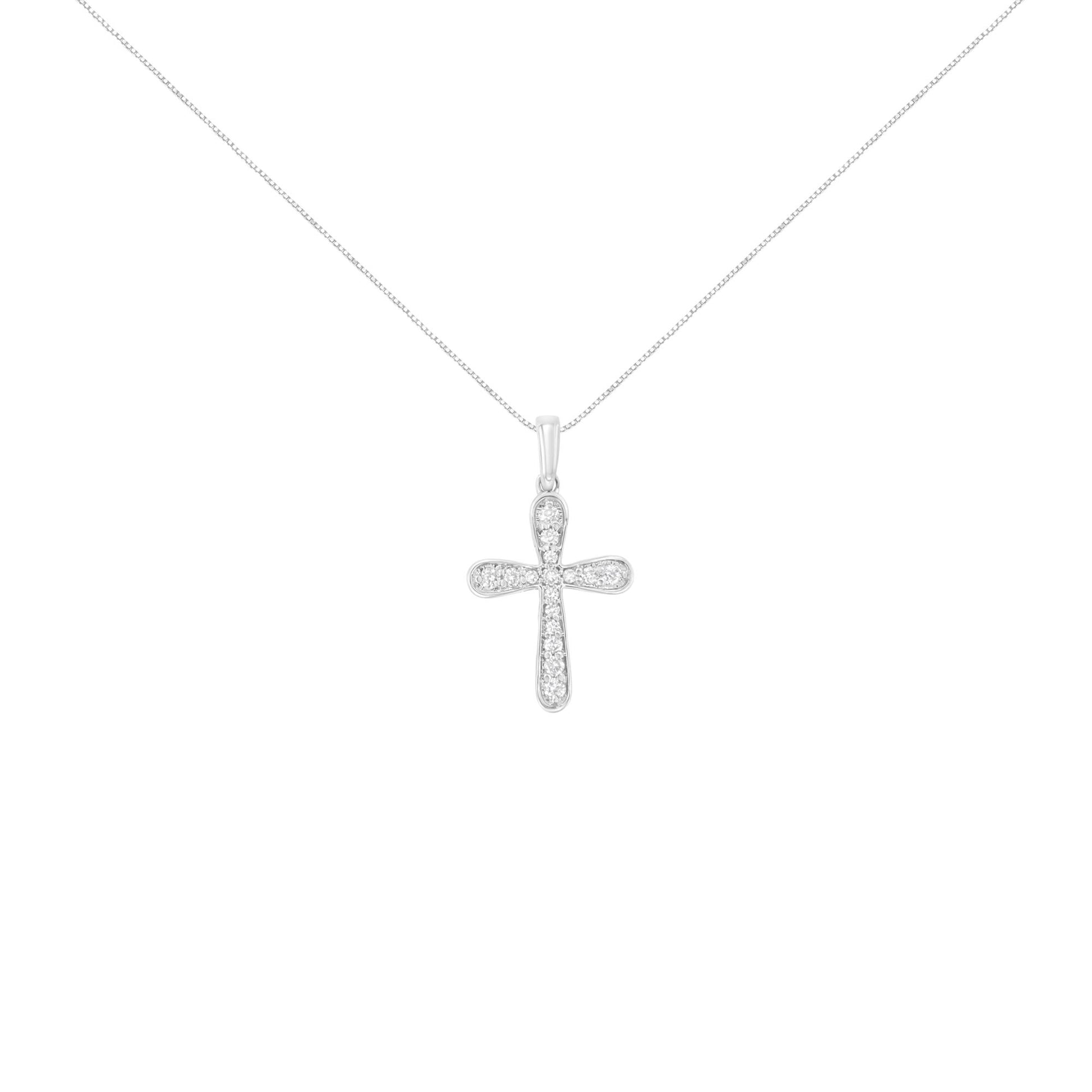 Front view of a white metal cross-shaped necklace pendant with small round white gemstones in prong settings, suspended on a fine chain against a white background.