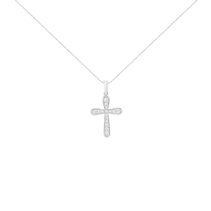 Front view of a white metal cross-shaped necklace pendant with small round white gemstones in prong settings, suspended on a fine chain against a white background.
