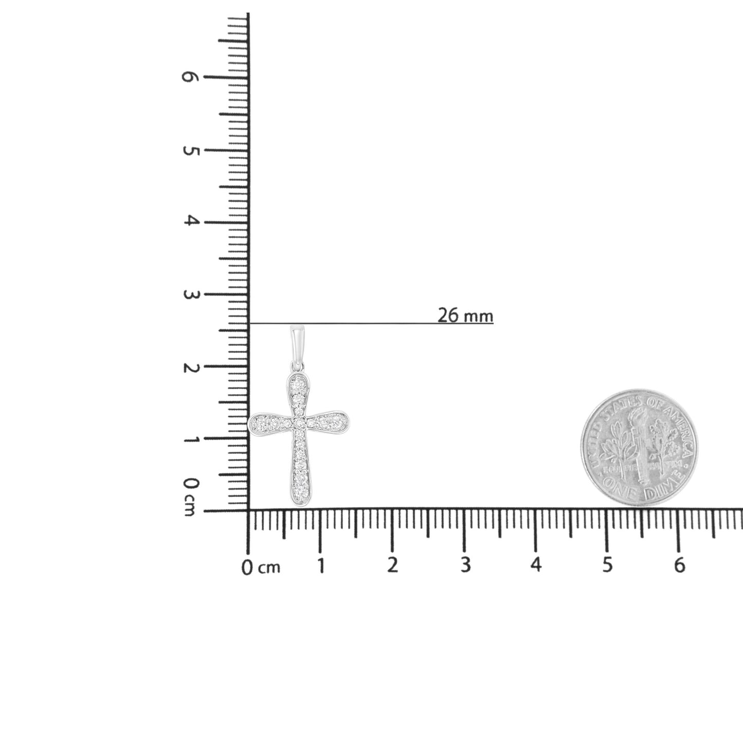 White metal cross-shaped necklace pendant with round white gemstones in prong setting, shown on a ruler and next to a dime for size reference, shot from the front.