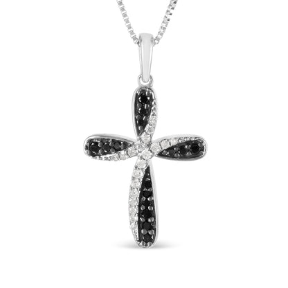 Front-facing white metal cross necklace pendant with alternating black and white round gemstones set in prongs, shown on a white background.