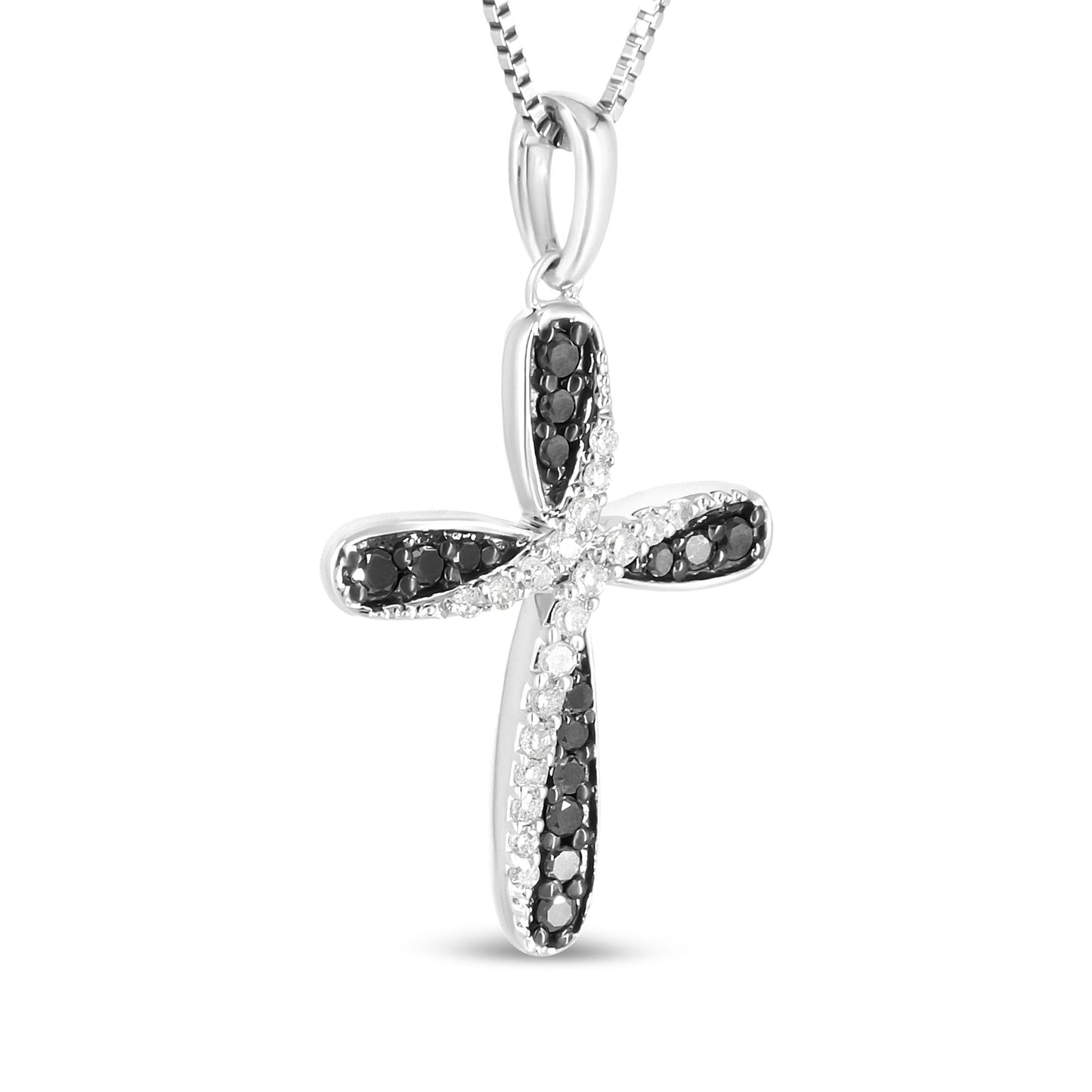 Close-up front view of a white metal cross-shaped necklace pendant featuring prong-set round white and black gemstones arranged in intersecting lines.