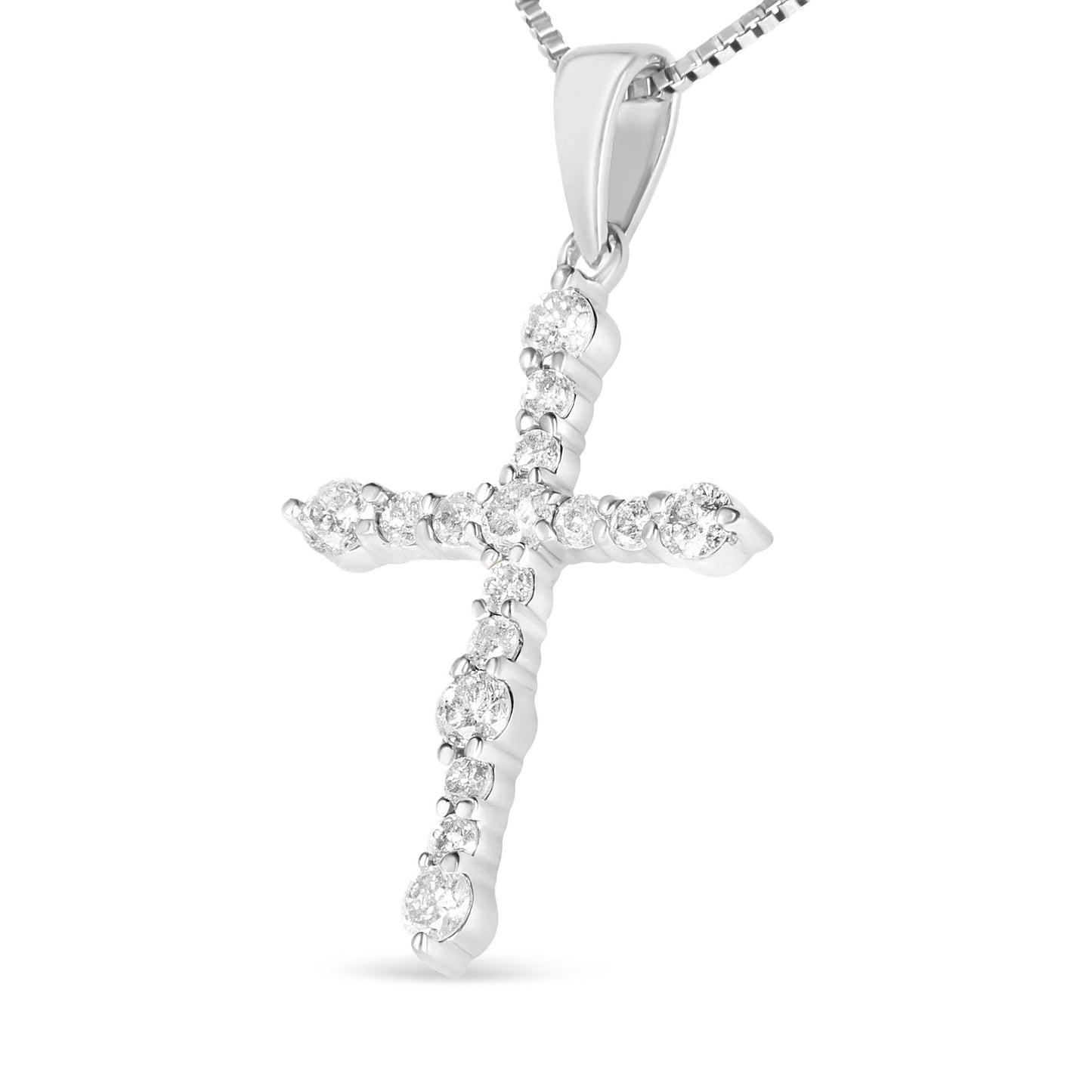 Close-up side angled view of a white metal cross-shaped necklace pendant with round white gemstones in prong settings, hanging from a box chain.